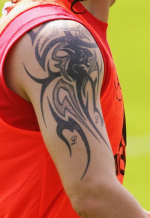Unidentified football players. Stupid tattoo (not a footballer though):
